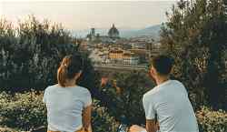 Romantic places to visit in Italy. Couple looking over Florence
