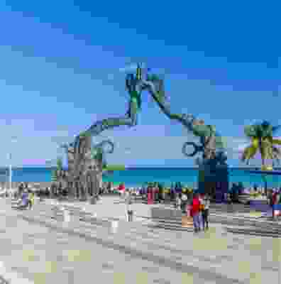 Locals gathering to look at the Portal Maya Sculpture, Playa del Carmen.