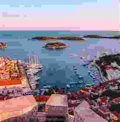A panoramic view of boats docking in Hvar at sunset.