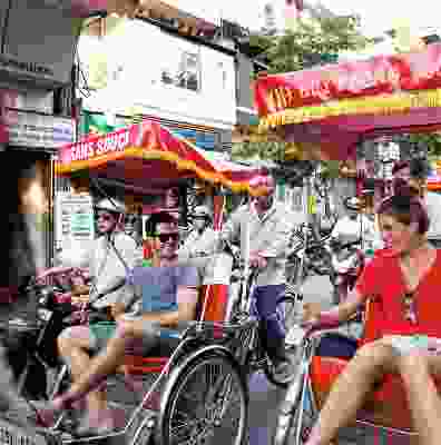 Travellers on rickshaws in vietnam Hanoi