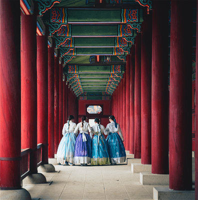 Koreans in temple dressed in traditional clothing