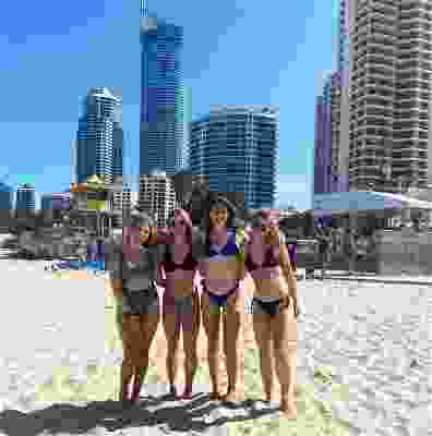 Girl group taking photo on the beach at Surfers Paradise.