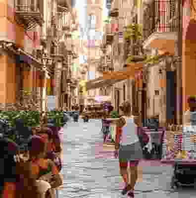 A traditional back street of cafes and shops in Palermo.