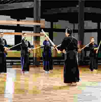 Travellers taking part in a Kendo class.