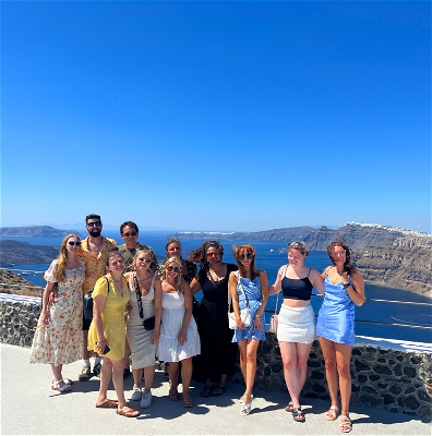 Group photo overlooking the coast of Santorini.