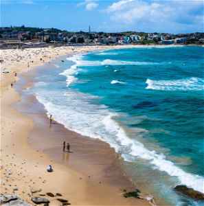 A busy Bondi Beach in Sydney with pristine blue water